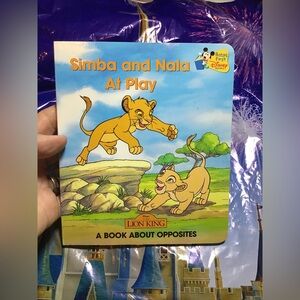 Simba and Nala at play a book about opposites the lion king hardcover